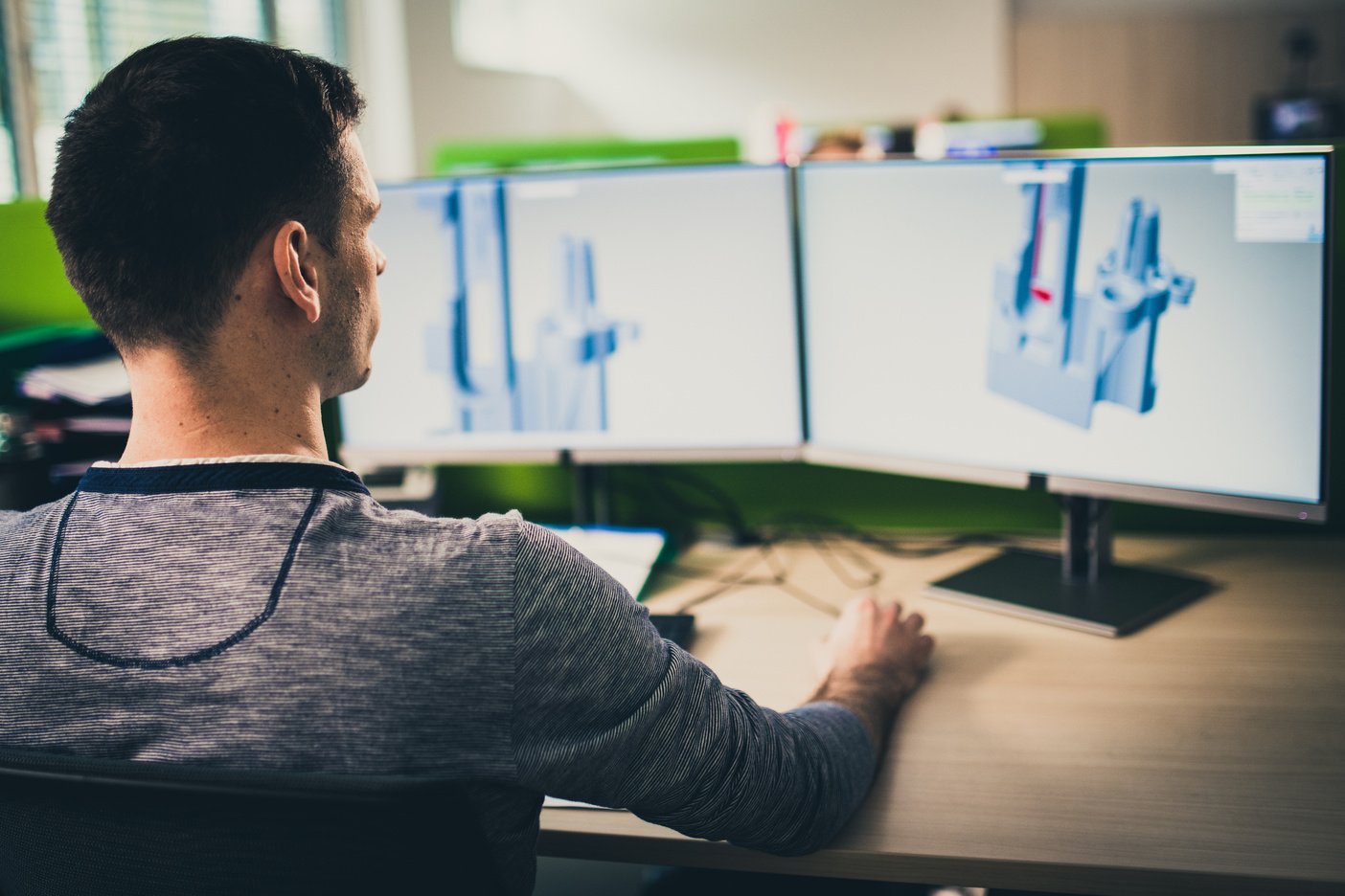 Engineer making a 3D model on a computer